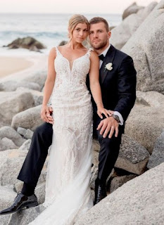 Dani Rhodes with her husband TJ Watt in their wedding dress