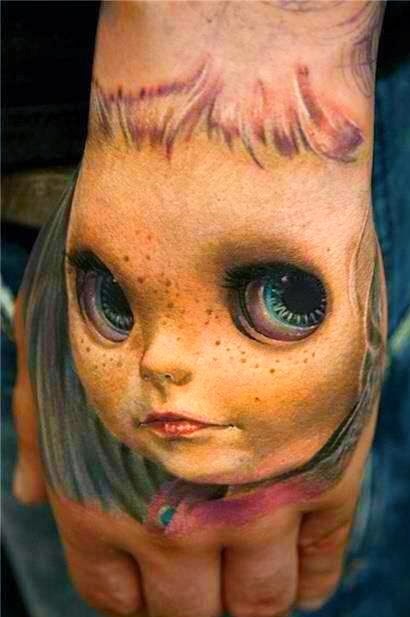 Ιmpressive 3D face doll tattoo.