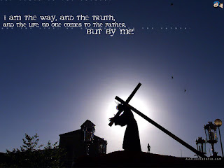 I am the way, and the truth and the life, no one comes to the father, but by me Jesus carrying cross with blue background sky photo