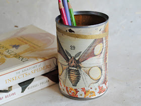 papered pencil cup with moth