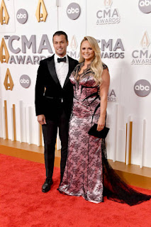 Miranda Lambert swooned in a form-fitting lace gown and husband Brendan McLoughlin looked smart in a black suit at the star-studded 56th annual CMA Awards in Nashville Wednesday.  The 39-year-old "If I Was A Cowboy" singer and a retired police officer in stylish outfits posed together on the glittering red carpet. One performer received a total of three nominations, including Entertainer of the Year and Singer of the Year.  The Somethin' Bad hitmaker opted for elegance in a floor-falling pink and black lace bodycon dress. Bridgestone Red A short train of black lace was visible behind her as she took pictures of her carpet in the arena. A sleeveless dress showed off her fit and stunning curves, and Miranda added a black velvet clutch to complete the look. Completed the evening look by wearing  The Grammy-winning singer parted her blonde hair to the side and let her hair flow down her shoulders in wavy curls. It was a classic, consisting of accentuating bronzer and nude lipstick.  He wore a black suit his pants and black velvet his suit his jacket, and to finish he chose a white shirt and a black bow tie.  Her two lovebirds, who stopped for a short photo together before entering the venue, looked in high spirits.  "It's Scorpio time. Tomorrow is my birthday, so being able to do what I want is a gift. And I've been doing this for a very long time! Added her. Star Celebrating her big 40th birthday on November 10.  Talented beauty was enjoying Miranda Lambert's Velvet Rodeo residency in Las Vegas, which started in early September this year. I plan to continue my stay at Planet Hollywood until.  Miranda was nominated for a total of three trophies at Wednesday's CMA Awards, including Palomino's Entertainer of the Year, Female Vocalist of the Year and Album of the Year. The  The House That Built Me singer has won a total of 14 of her CMA Awards throughout her career.  Other awards she has received include 3 Grammy Awards, 29 Academy of Country Music Awards, and 6 American Her Country Awards.  Miranda gave her two memorable performances at her 2022 CMA Awards. She sang Geraldine from her Palomino album, Carrie She performed Loretta's Lynn tribute with Underwood and Reba her McEntire.  Before Miranda Lambert honored Loretta Lynn with a special performance at the 2022 CMA Awards, she turned music's biggest night into a date night with husband Brendan McLoughlin.
