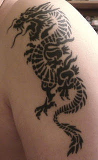 Kevin Tribal Dragon Arm Tattoo