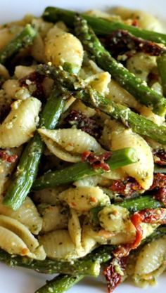 Pesto Pasta with Sun Dried Tomatoes and Roasted Asparagus/Delicious. I used whole wheat shells, store bought pesto and shredded mozarella. I also cut the asparagus in pieces before I roasted it. The fried egg on the top was awesome.Will make again.