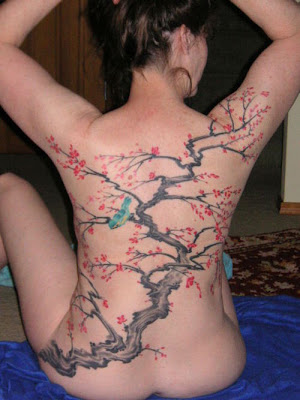 tattoos for women on back. Yes the upper ack tattoo has