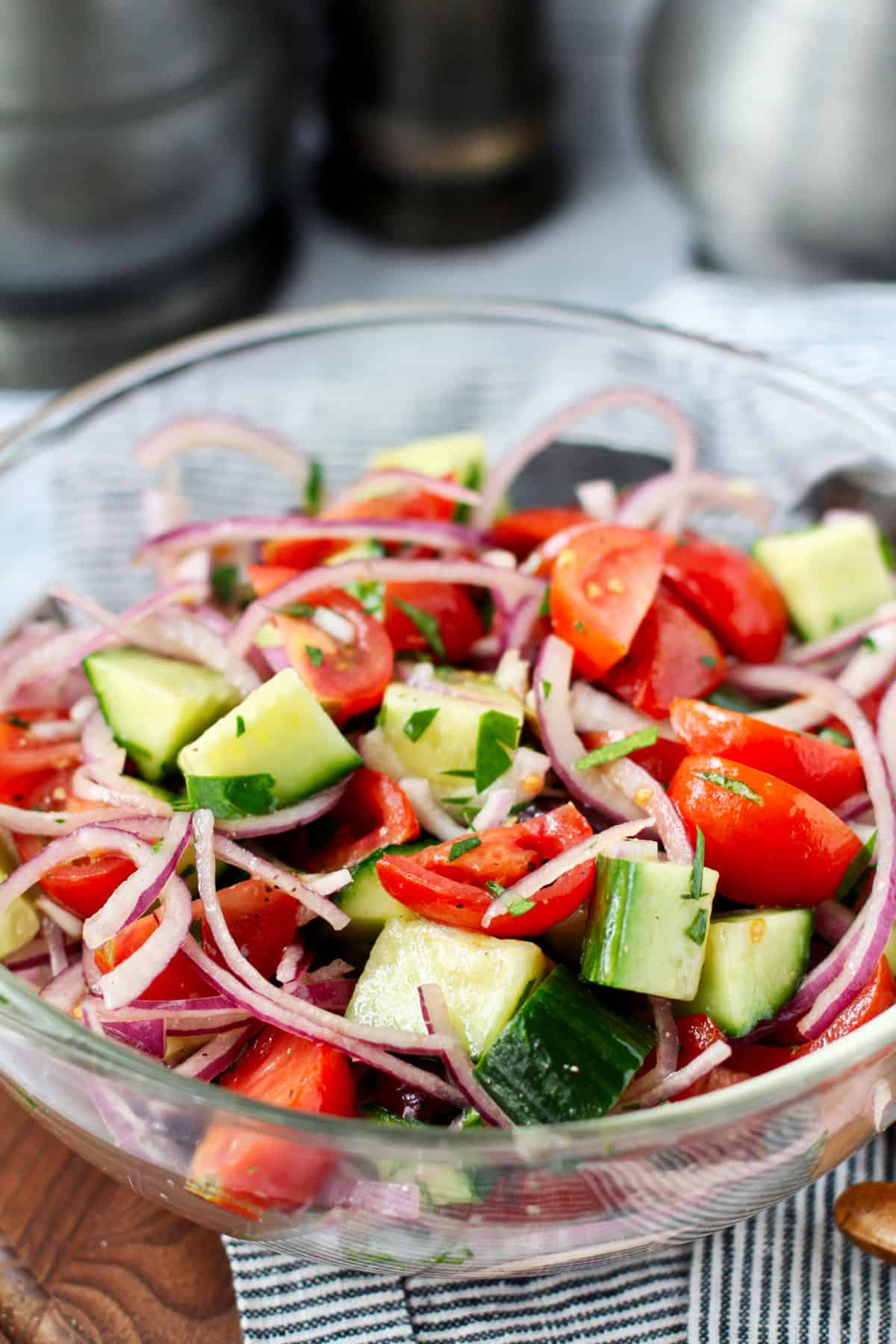 Tomato and cucumber salad in a plate.