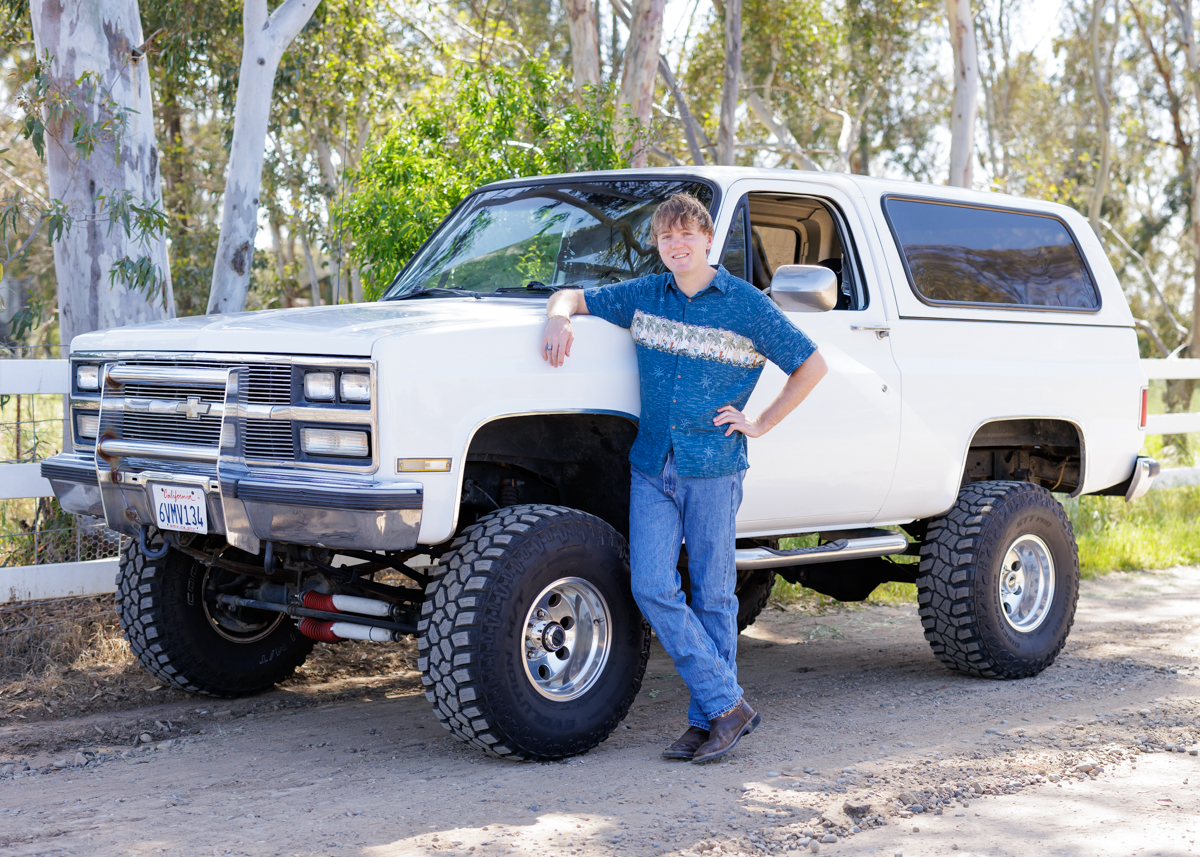 senior boy with white bronco