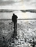 Ernest Bloch hunting his beloved agates in waders, a beret and a woolen cape on Agate Beach