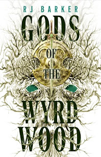 Cover for book "Gods of the Wyrdwood" by RJ Barker. A pattern of branches that forms the mask of an animal head, with a sword and shield in the midst of it.