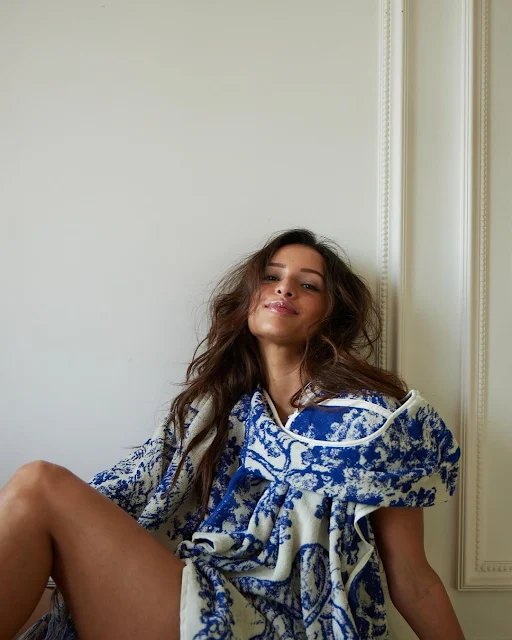 Tripti Dimri posing in a blue and white Christian Dior towel dress, messy hair