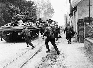 Commandos engaged in house to house fighting with the Germans at Riva Bella, near Ouistreham