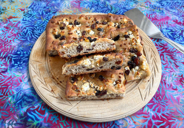 Food Lust People Love: Slightly sweet and a little savory, this feta and mixed fruit focaccia is the perfect snack to eat with a cup of tea or even a cold glass of beer or a cocktail. The somewhat bitter candied peel and soaked dried fruit are a great combination with the salty feta and soft pillowy bread.