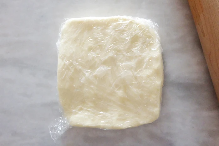 butter flattened into 8" square in plastic