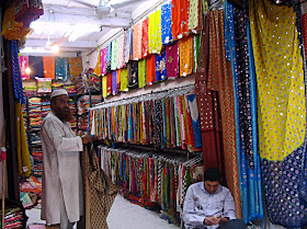 Cloth merchant in shop in market