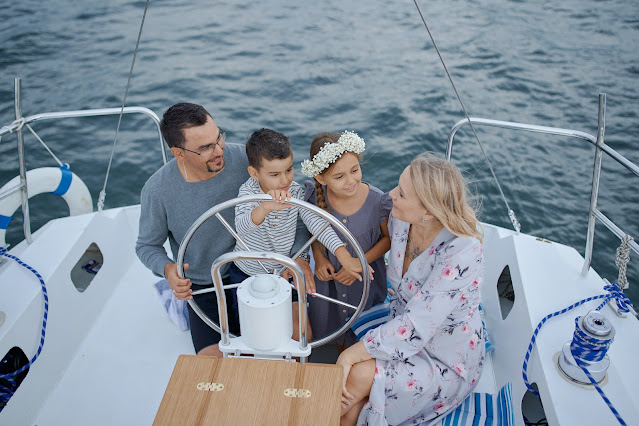 https://www.pexels.com/photo/happy-family-on-yacht-sailing-on-sea-during-trip-5368745/