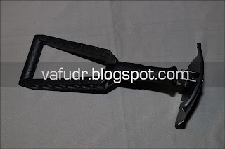 Mil-tec Trifold Shovel with Pouch. Shaped into the form of a hoe