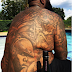Rick Ross shows off his Notorious B.I.G tattoo