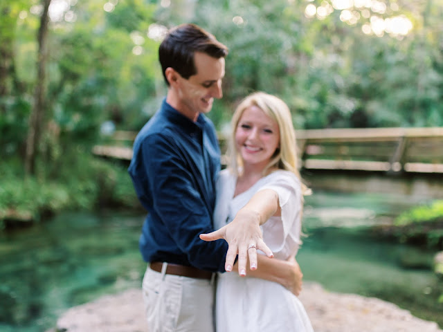 bride shows off her engagement ring