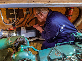 Photo of Phil working on Ravensdale's broken down Webasto heater