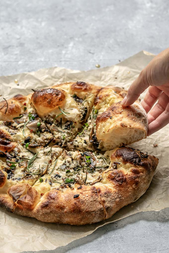 Vegan Caramelized Mushroom Pizza - This vegan white sauce pizza is topped with garlicky caramelized mushrooms and onion