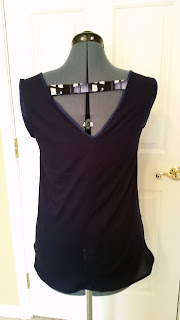 Back view of sleeveless shirt with V-shape top and Tardis strap across the V.