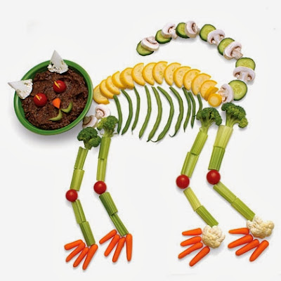 Just assorted fresh vegetables and a bowl of dip arranged in the shape of a spooky cat and then you'll get an amazing Black Bean Cat Crudités appetizer for kids party.