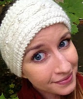 http://www.ravelry.com/patterns/library/winter-cabled-headband-with-pearl-button-accents