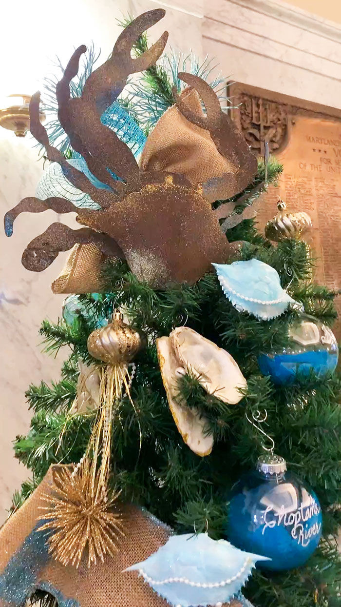 Crab topping a blue Christmas tree