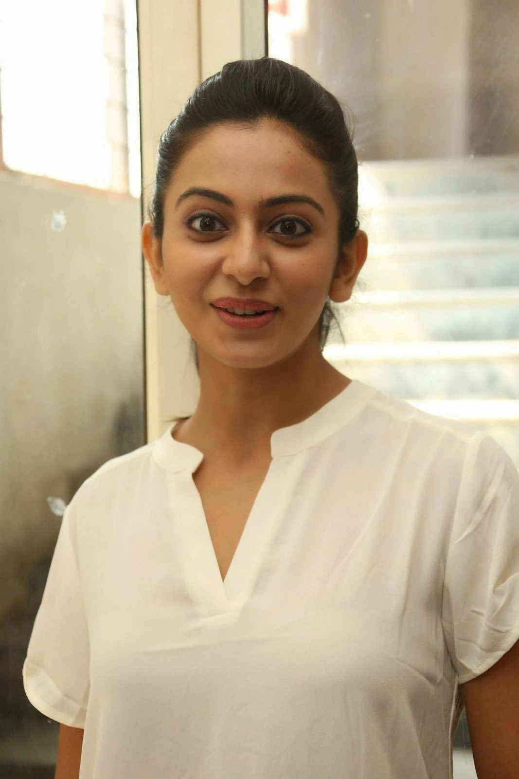 Rakul Preet Singh Stills In White Shirt  At Movie Theater Coverage