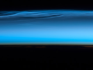 picture of noctilucent clouds near the top of Earth's atmosphere
