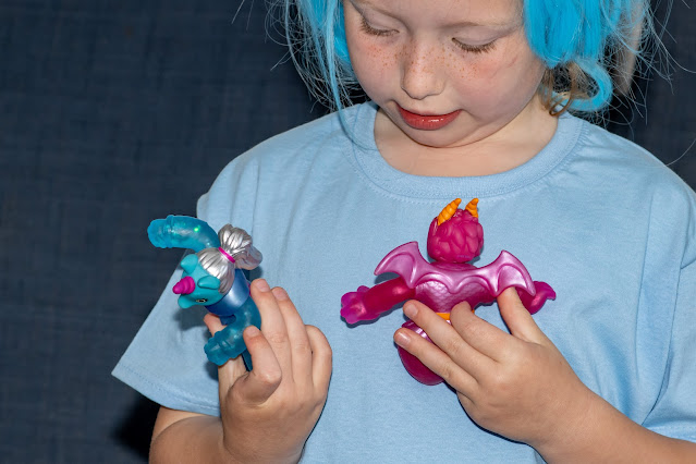 A 6 year old girl looking at her GooZonian toys received to review