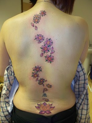 Cherry Blossom Tattoo and Lotus Tattoo Design on Female Lower Back