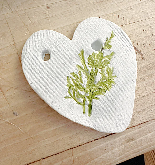 clay heart with painted greenery texture