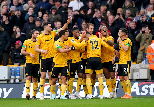 Wolves players celebrate goal during their 3-0 win over Livepool