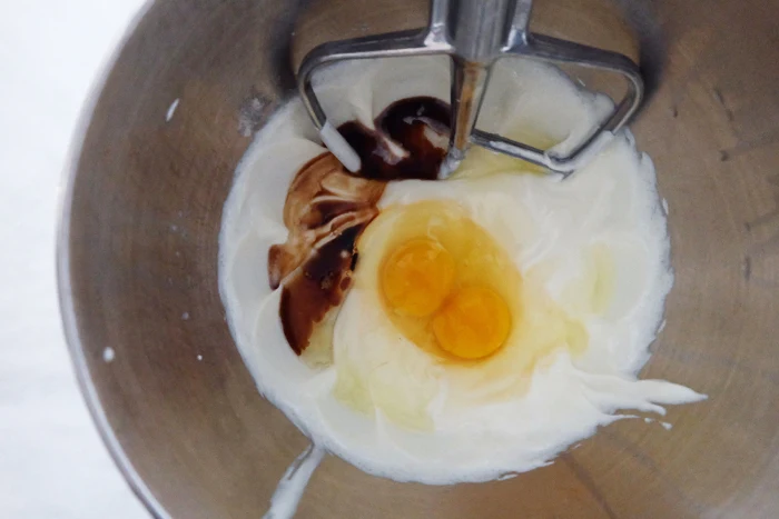 mixing cheesecake filling ingredients in mixer