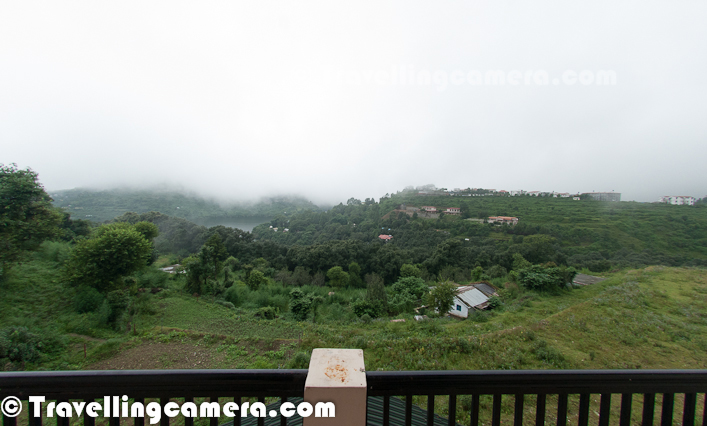 Few weeks back I was at Naukuchiatal which is a peaceful hill station in Uttranchal and near to Bheemtaal & Nainitaal. During the visit, we stayed at Firdaus and it was wonderful experience with never-ending freshness of the hills all around. Let's check out this Photo Journey to know about Firdaus and interesting things around it.Here is the place where we spend a nice weekend - Firdaus We started our journey from Delhi in early morning and reached there by noon. It was a decent drive except few road related issues on the way. Best way to reach Naukuchiatal from Delhi is to take train to Kathgodam and then 30-40 minutes drive. Drive from Kathgodam to  Naukuchiatal through Beemtaal is beautiful...After reaching the place and parking the car, we moved towards the place we were about to spend the weekend. I was very excited about it, as I love spending time in hills :) Here is the view of Firdaus from Parking place. Firdaus is actually surrounded by hills. It's front part faces the lake & an international school on hill top. Generally it's located at a peaceful place with no disturbances. Clouds at Firdaus on that weekend were quite welcoming & slowly we realized that it's a usual stuff there..After keeping all the stuff in rooms, we came out for a cup of tea. There is decent place outside with green lawn surrounded by colorful flowers and plants. Above photograph is processed a HDR in Photomatix, as it's quite challenging to capture hilly details in one shot and I didn't want to miss the cloud play hereFirdaus Lawn is best place to have tea. During the weekend none of us wanted to tea inside the rooms. Either it was lawn or balconies. Weather around this place was wonderful Initially I wanted to capture this frame without face, but Nandan turned back as I was about to click. This is one of my favorite photographs form this trip. This one really shows the mood while having tea at Firdaus.Here is a zoomed view of Naukuchiatal (Lake) from Firdaus. This one is shot through some of trees around Firdaus and there is another photograph which shows Lake-view from balcony on first floor.After some tea outside, it was time to have some rest and gear up for exciting evening around the place. As I entered again, somehow I felt like entering a different pace. Probably this time I was more relaxed and noticed many things insideHere is what we see as we enter from main gate of Firdaus. There is a common seating place on entrance with nice sofa, some comfortable muddhas.On right side of living room, there is kitchen separated with a door and dining area around the corner. Firdaus looks like a typical Hilly House, which we usually see in Bollywood movies. I loved the wood-word inside - Roof-tops, huge windows, furniture etcOn left side of the living room, there is a huge room with double bed & table-chairs etc. This room is quite big and an extra bed can be comfortably fit inside itHere is how we see living-room from this room on ground floor. Now, it was time to go up and explore more. Stairs from living room on ground floor leads to a common lobby on first floor. There is a balcony attached to this lobby. Above photograph shows view of lake and surrounding hills from the same balcBirds keep visiting the place as there are lot of plants & trees around the house.And also there are appropriate arrangement for birds at FirdausThere are some colorful plants and flowers around the place. Entrance of Firdaus is beautifully decorated with flowers in hanging pots Colorful flowers all around the house are very well maintained and there are some vegetable plants as wellFirdaus  has a kitchen garden in the backyard and a farm in front of itKitchen garden had - brinjals, green chilly, potatoes, tomatoes etcNext morning we went up for a walk. It was a simple trek crossing through a village and few hills having amazing view of Lake covered with cloudsDuring the walk we met some sweet faces in the village. all of them were welcoming and it was nice to interact with themStay at Firdaus was wonderful experience and hope to visit this place again with new plans...