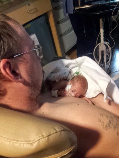 Daddy holding baby B