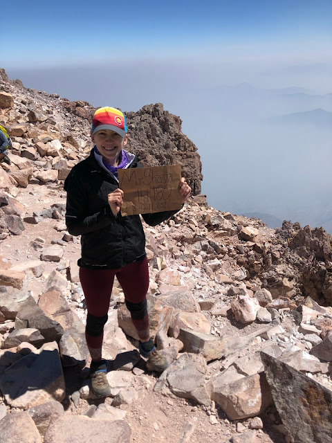 woman on the top of a 14,000 foot tall mountain