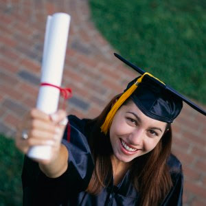 Photo: Graduate celebrating with her Diploma (from Karen's Blog)