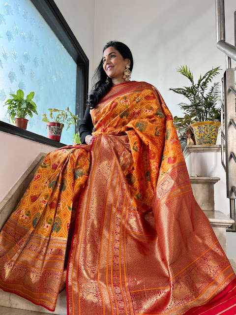 Gold Patola saree with Kanjeevaram border.