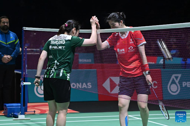 Busanan Ongbamrungphan (L) of Thailand greets Gao Fangjie of China after their women's singles round of 32 match at the Malaysia Open badminton tournament 2024 in Kuala Lumpur, Malaysia, Jan. 10, 2024. (Photo by Chong Voon Chung/Xinhua)