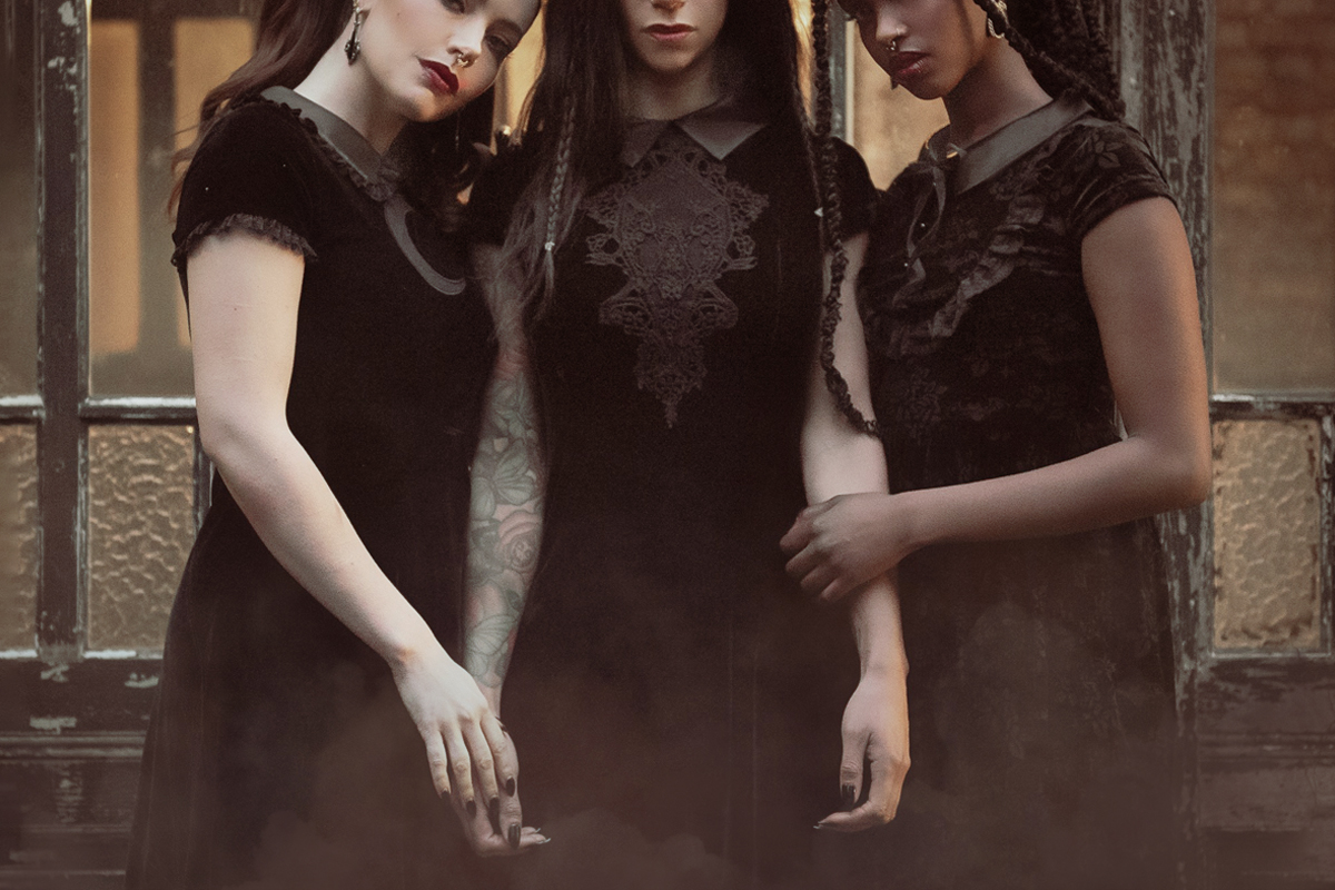 three beautiful women models in a simple black dress outfits inspired by witch aesthetics