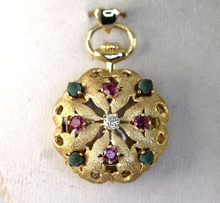 http://www.ebay.com/itm/Vintage-diamond-ruby-tourmaline-watch-pendant-14K-yellow-gold-1-05CT-hearts-9-8G-/231932253856?hash=item36003d56a0