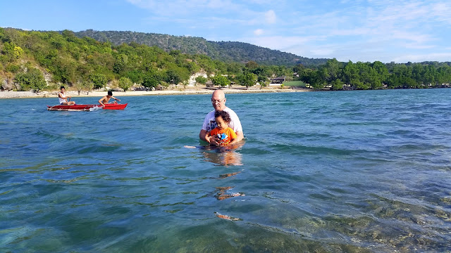 Father and son enjoying the water at Pacman Beach Resort Complex