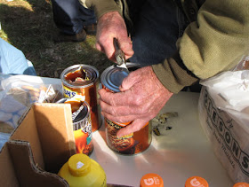 opening cans with a screwdriver and pliers