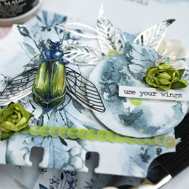 Memorydex Use Your Wings beetle card using the P13 New Moon collection; with fussy cut ephemera, Prima opal magic paint, Reneabouquets beautiful beads in moonstone, Tim Holtz transparent wings, funky floral and skeleton leaves die cuts and Heidi Swapp silver Minc foil
