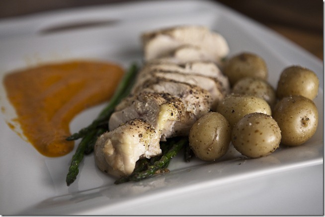 Oven Roasted Seasoned Chicken Breast over Garlic Sauteed Asparagus with Colombian Baby Potatoes and Red Pepper Sauce-1