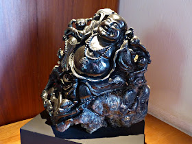 Black sapphire sculpture of Happy Buddha and attendant boys 