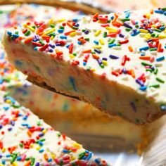 The rainbow of colors and flavors you love in birthday cake mix—plus lots of sprinkles. You'll fall in love with these no-bake birthday cake cheesecake. Get the recipe at Delish.com. #delish #easy #recipe #nobake #nobakerecipes #birthdaycake #birthdayrecipes #cheesecake #dessert #dessertrecipes #funfetti