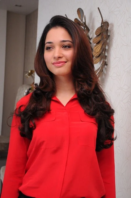 Tamanna looking stunning in a red outfit.