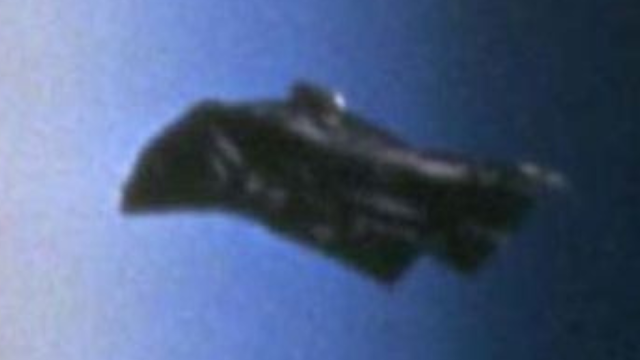 Close up of the Black Knight Satellite UFO over Earth.